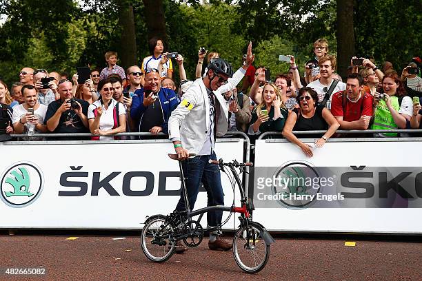 Former professional road cyclist David Millar laughs after struggling to unfold his Brompton Bicycle at the start of the Brompton World Championship...