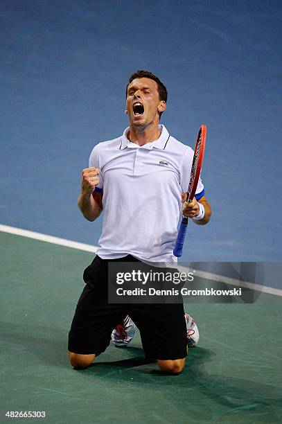 Tobias Kamke of Germany celebrates after winning his match against Julien Benneteau of France during day 1 of the Davis Cup Quarter Final match...