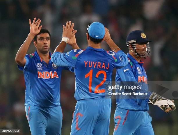 Ravichandran Ashwin of India is congratulated by his teammates after dismissing AB de Villiers of South Africa during the ICC World Twenty20...