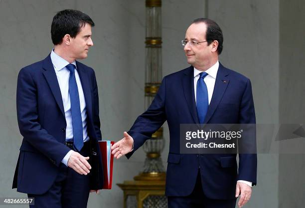Newly appointed French Prime Minister, Manuel Valls and French President Francois Hollande leave after a cabinet meeting at the Elysee Palace on...