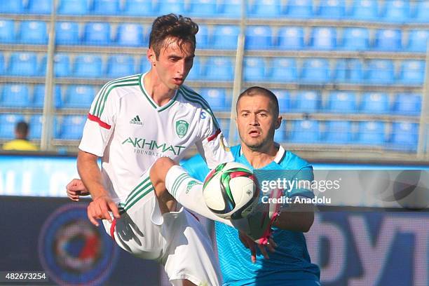 Viktor Fayzulin of Zenit St.-Petersburg vies with Jose Mauricio of Terek during the Russian Football Premiere League football match between Zenit...