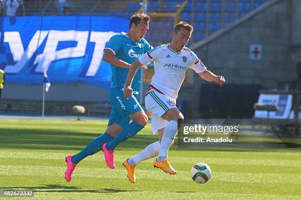 Artyom Dzuba of Zenit St.-Petersburg vies with Andrey Semenov of Terek during the Russian Football Premiere League football match between Zenit...