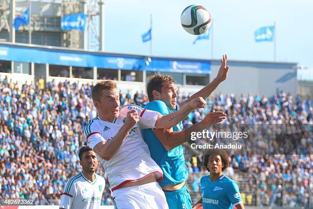 Artyom Dzuba of Zenit St.-Petersburg vies with Andrey Semenov of Terek during the Russian Football Premiere League football match between Zenit...