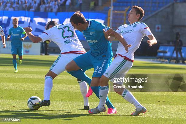 Artyom Dzuba of Zenit St.-Petersburg vies with Facundo Piriz and Daler Kuzyaev of Terek during the Russian Football Premiere League football match...