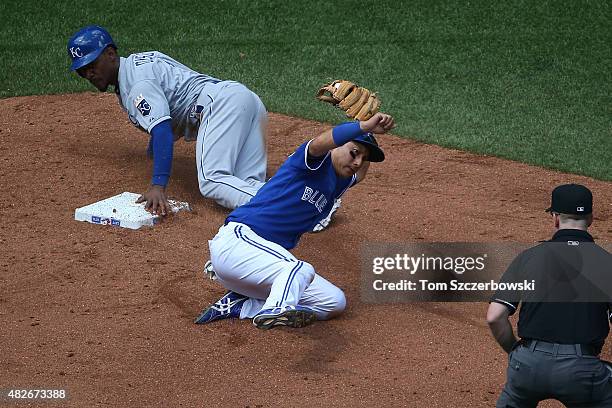 Munenori Kawasaki of the Toronto Blue Jays tags out Jarrod Dyson of the Kansas City Royals as he tries to steal second base in the eighth inning...