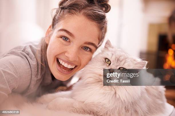 excited selfies with her feline friend - pets selfie stock pictures, royalty-free photos & images