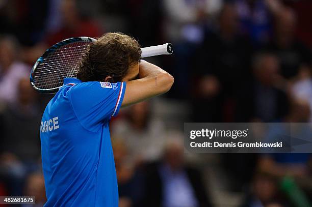 Julien Benneteau of France reacts during his match against Tobias Kamke of Germany during day 1 of the Davis Cup Quarter Final match between France...