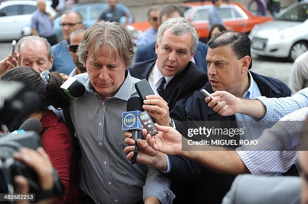 Former Uruguayan Economy Minister Fernando Lorenzo speaks with the press upon leaving the court on April 4, 2014 in Montevideo. Lorenzo was...