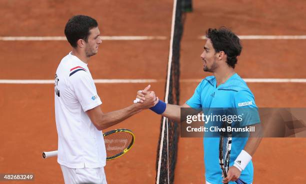 Fabio Fognini of Italy shakes hands at the net after his four set victory against James Ward of Great Britain during day one of the Davis Cup World...