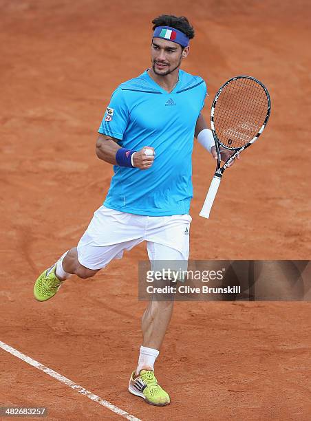 Fabio Fognini of Italy celebrates a point against James Ward of Great Britain during day one of the Davis Cup World Group Quarter Final match between...