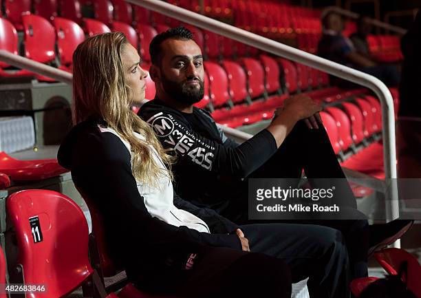 Women's bantamweight champion Ronda Rousey of the United States waits backstage with Edmond Tarverdyan during the UFC 190 weigh-in event at the HSBC...