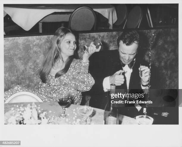 Actor Jack Lemmon having a drink thrown over him by his wife Felicia Farr at an American Film Institute Event, Century Plaza Hotel, California, March...