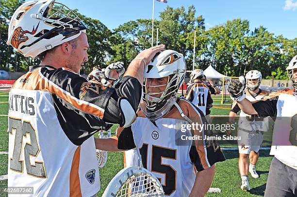 Mark Matthews of the Rochester Rattlers and goalie John Galloway of the Rochester Rattlers celebrate after they defeated the Ohio Machine 12-8 to...