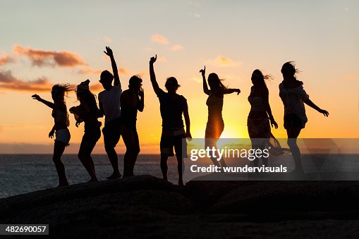 Young Party People Dancing On A Rock Young Party People Dancing On A Rock