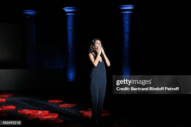 Humorist Florence Foresti acknowledges the applause of the audience during the traditional throw of cushions at the final of the 'Madame Foresti'...