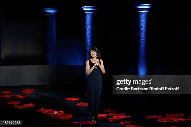 Humorist Florence Foresti acknowledges the applause of the audience during the traditional throw of cushions at the final of the 'Madame Foresti'...