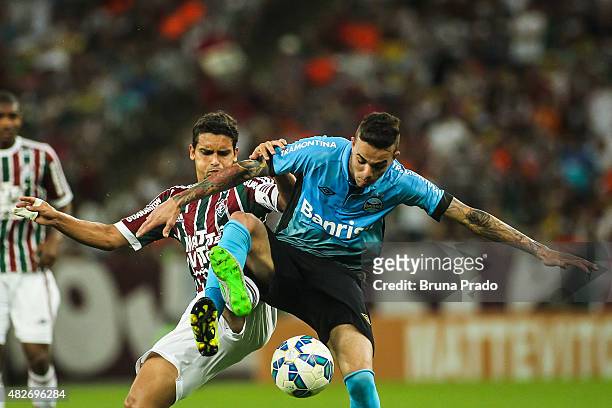 Renato of Fluminense struggles for the ball with a Luan of Gremio during a match the Brasileirao Series A 2015 match between Fluminense and Gremio at...