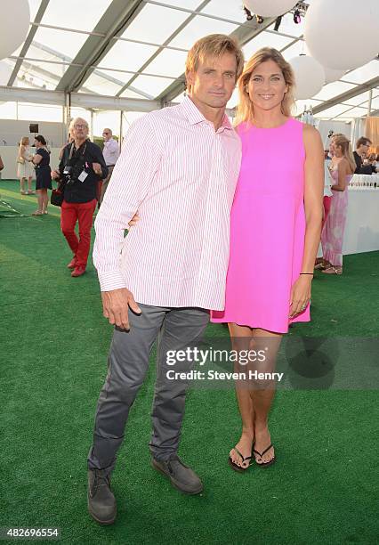 Laird Hamilton and Gabrielle Reece toasts to Paddle for Pink with Moet Ice Imperial on August 1, 2015 in Bridgehampton, New York.