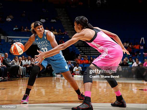 Rebekkah Brunson of the Minnesota Lynx handles the ball against the Tulsa Shock on August 1, 2015 at the BOK Center in Tulsa, Oklahoma. NOTE TO USER:...