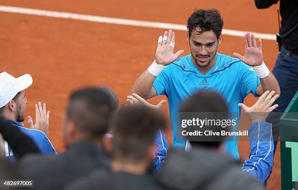 Fabio Fognini of Italy celebrates with team mates after his four set victory against James Ward of Great Britain during day one of the Davis Cup...