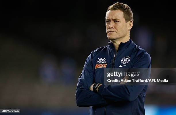 Interim Coach of the Blues John Barker looks on during the 2015 AFL round 18 match between the Carlton Blues and the North Melbourne Kangaroos at...