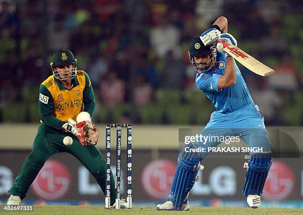 India batsman Virat Kohli plays a shot during the ICC World Twenty20 cricket tournament second semi-final match between India and South Africa at The...