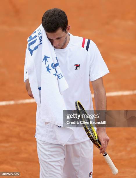 James Ward of Great Britain shows his dejection against Fabio Fognini of Italy during day one of the Davis Cup World Group Quarter Final match...