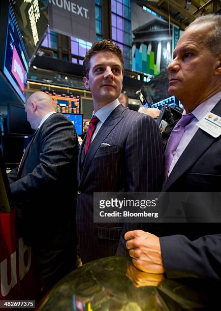Matt Maloney, co-founder and chief executive of GrubHub Inc., center, waits for the initial public offering listing on the floor of the New York...