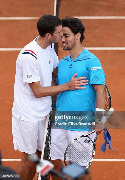 Fabio Fognini of Italy shakes hands at the net after his four set victory against James Ward of Great Britain during day one of the Davis Cup World...