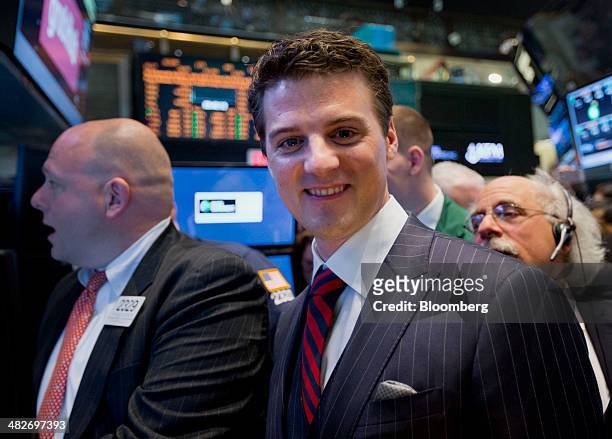 Matt Maloney, co-founder and chief executive of GrubHub Inc., right, stands for a photograph while waiting for the initial public offering listing on...