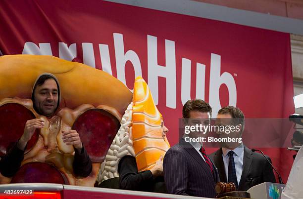 Matt Maloney, co-founder and chief executive of GrubHub Inc., second from right, gets ready to ring the opening bell on the floor of the New York...