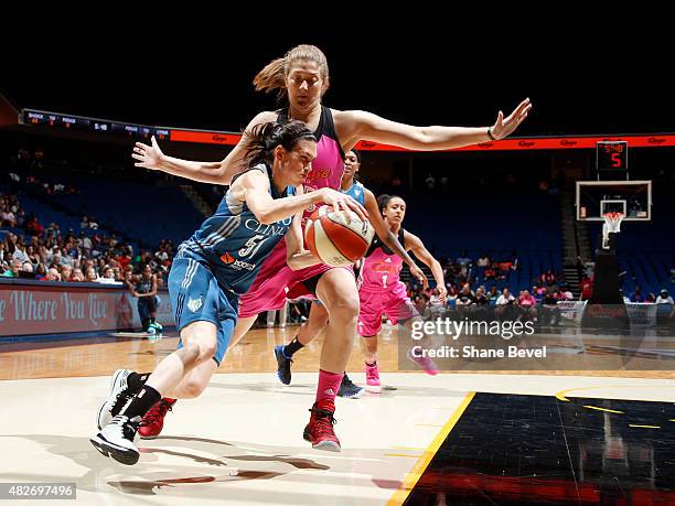 Anna Cruz of the Minnesota Lynx drives to the basket against Thersea Plaisance of the Tulsa Shock on August 1, 2015 at the BOK Center in Tulsa,...