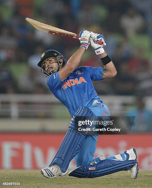 Virat Kohli of India hits out for six runs during the ICC World Twenty20 Bangladesh 2014 semi final between India and South Africa at Sher-e-Bangla...