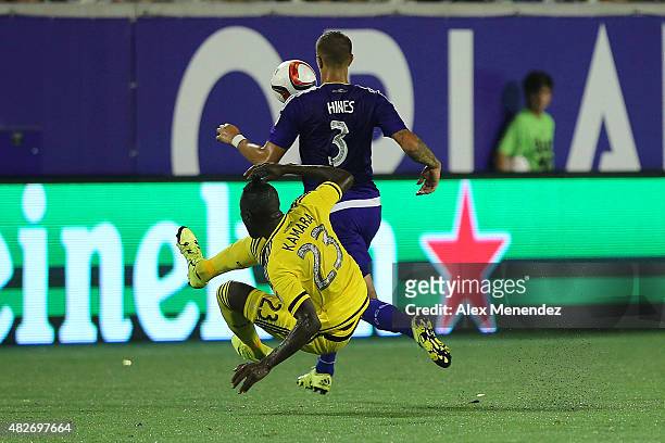 Kei Kamara of Columbus Crew SC and Seb Hines of Orlando City SC fight for a ball during a MLS soccer match between the Columbus Crew SC and the...