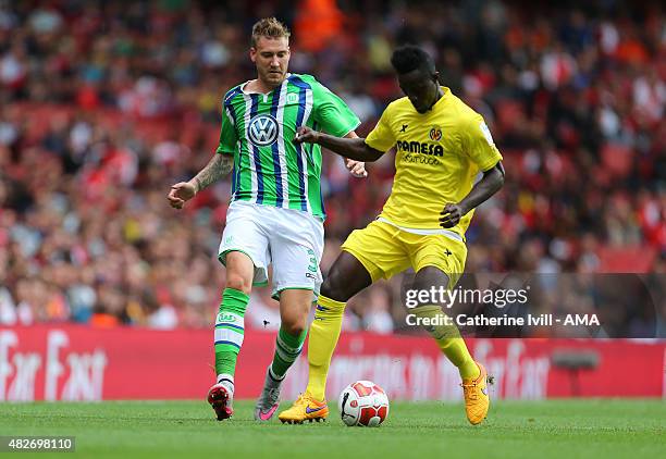 Nicklas Bendtner of Wolfsburg and Eric Bailly of Villarreal during the Emirates Cup match between VfL Wolfsburg and Villarreal at Emirates Stadium on...