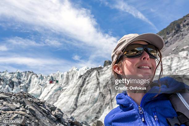 woman hiker with mountain and glacier background - fox glacier stock pictures, royalty-free photos & images