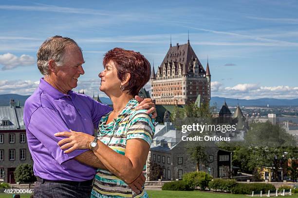 senior couple in quebec city - chateau frontenac hotel stock pictures, royalty-free photos & images