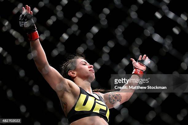 Claudia Gadelha of Brazil celebrates her win overJessica Aguilar of the United States in their strawweight bout during the UFC 190 Rousey v Correia...