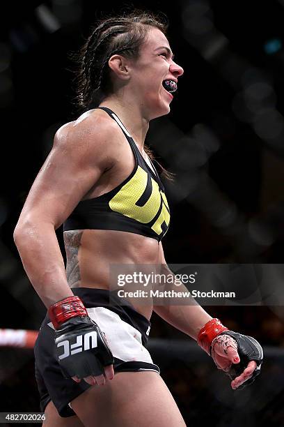 Claudia Gadelha of Brazil celebrates her win overJessica Aguilar of the United States in their strawweight bout during the UFC 190 Rousey v Correia...