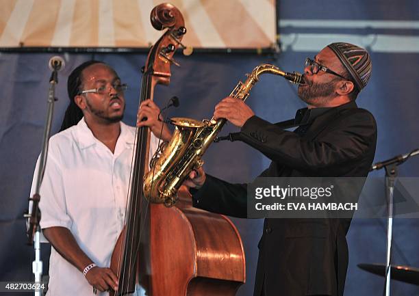 Saxophonist Kenny Garrett performs along bassist Corcoran Holt at the Newport Jazz Festival in Newport, Rhode Island, on August 1, 2015. AFP PHOTO/...
