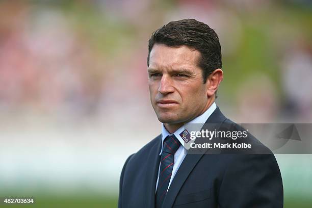 Knights coach Danny Buderus watches on during his team's warm-up before the round 21 NRL match between the St George Illawarra Dragons and the...