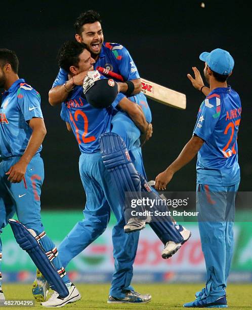 Virat Kohli of India is hugged by Yuvraj Singh after he hit the winning runs as India won the ICC World Twenty20 Bangladesh 2014 2nd Semi-Final match...