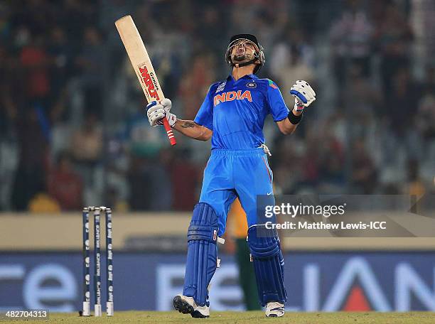 Virat Kohli of India celebrates hitting the winning runs during the ICC World Twenty20 Bangladesh 2014 Semi Final match between India and South...