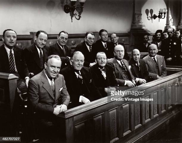 The jury appear favourably-disposed in a courtroom scene from the film 'Roxie Hart', 1942.