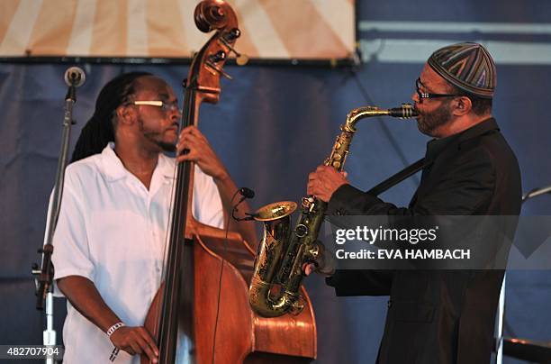 Bassist Corcoran Holt performs with saxophonist Kenny Garrett at the Newport Jazz Festival in Newport, Rhode Island, on August 1, 2015. AFP PHOTO/...