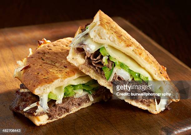 philadelphia cheese steak panini - sandwich stock-fotos und bilder