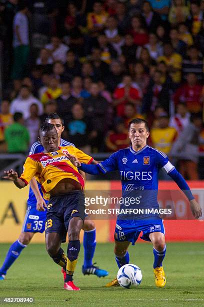 Jefferson Cuero of Monarcas vies for the ball with Jose Torres of Tigres during a 2nd round match between Morelia and Tigres UANL as part of the...