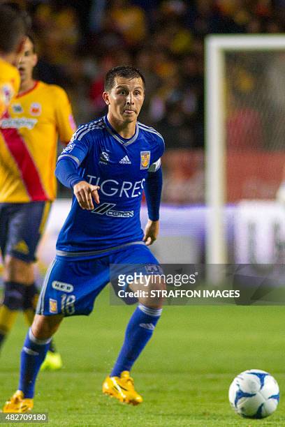 Jose Torres of Tigres drives the ball during a 2nd round match between Morelia and Tigres UANL as part of the Apertura 2015 Liga MX at Jose Maria...
