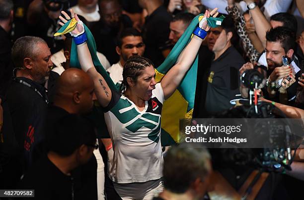 Bethe Correia of Brazil prepares to enter the Octagon before facing Ronda Rousey of the United States in their UFC women's bantamweight championship...