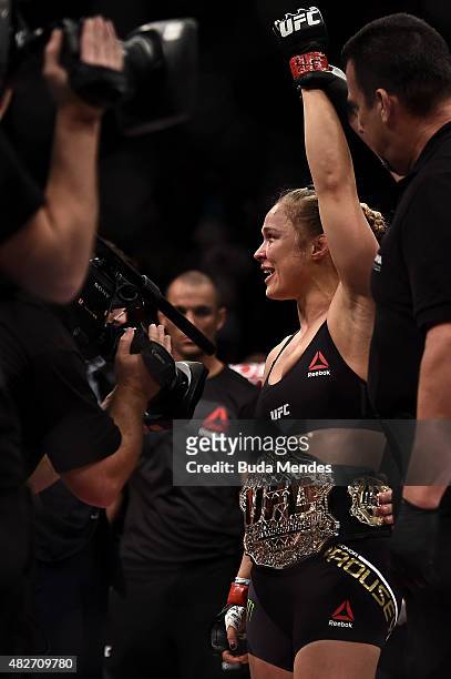 Ronda Rousey of the United States celebrates victory over Bethe Correia of Brazil in their bantamweight fight during the UFC 190 Rousey v Correia at...